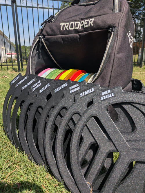 Disc golf bag dividers organizing discs by type inside a bag